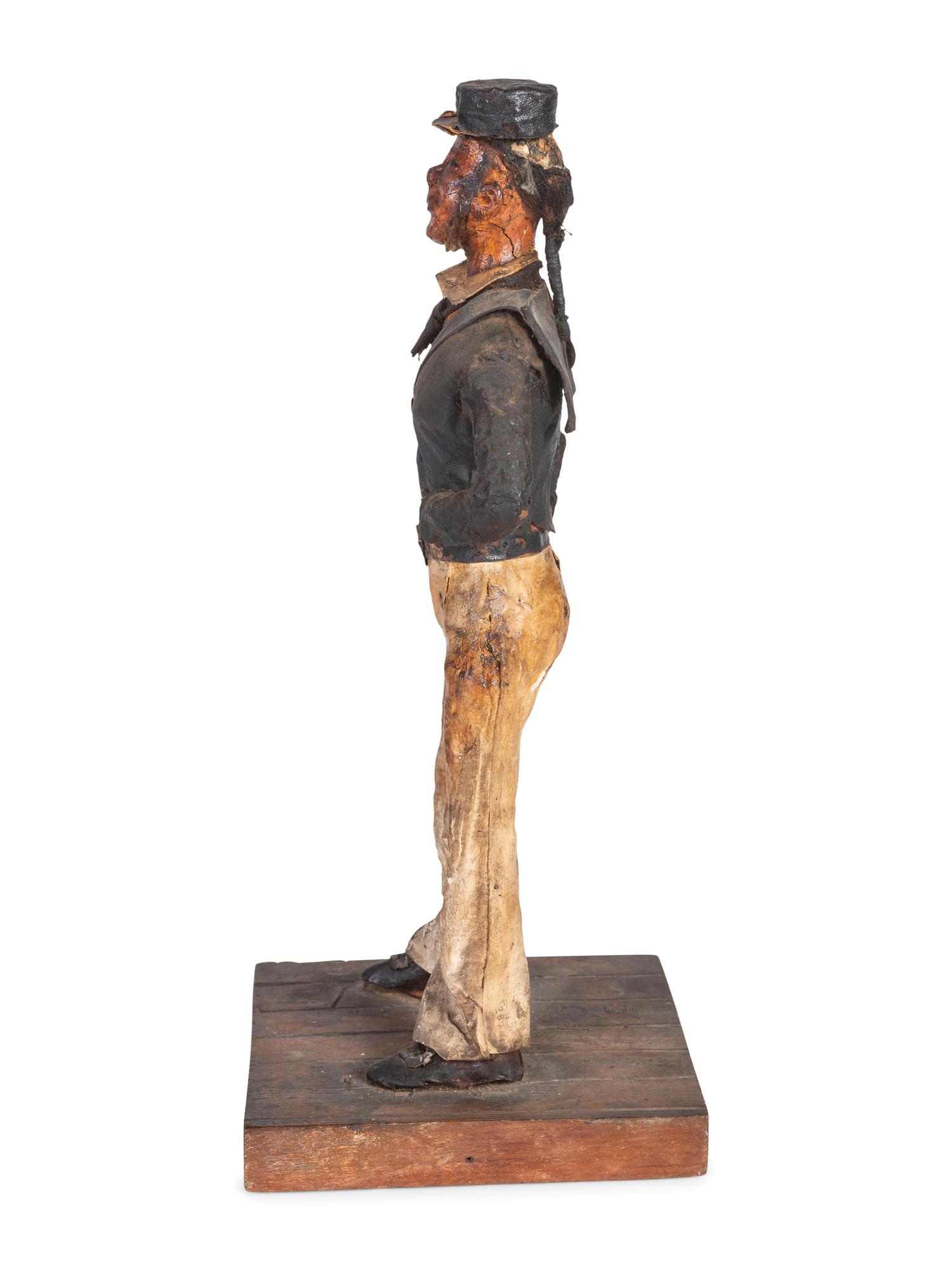 A Carved Wood and Papier-Mache Figure of a Sailor