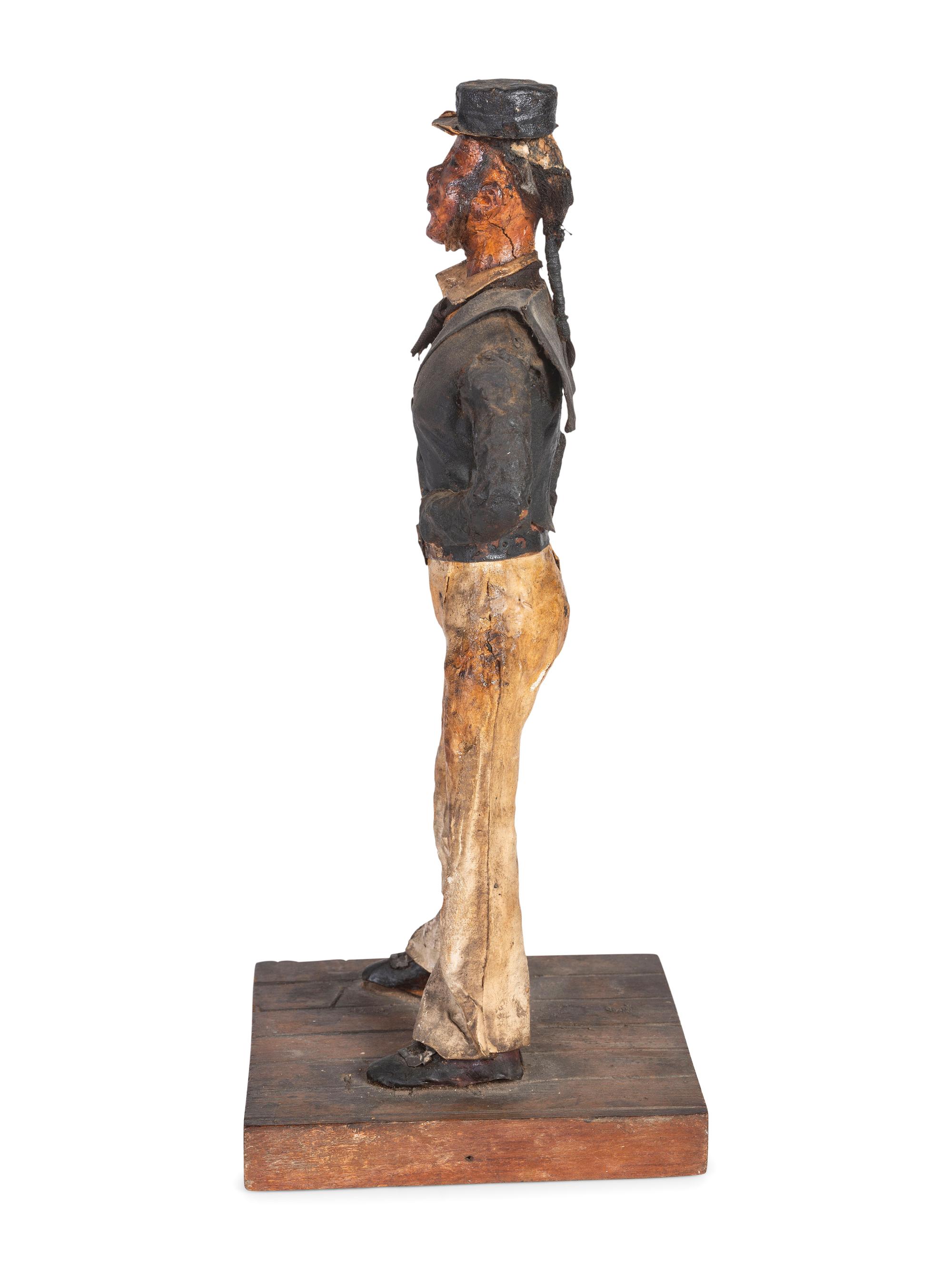 A Carved Wood and Papier-Mache Figure of a Sailor