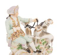 A Meissen Porcelain Figural Group of a Man with Hounds