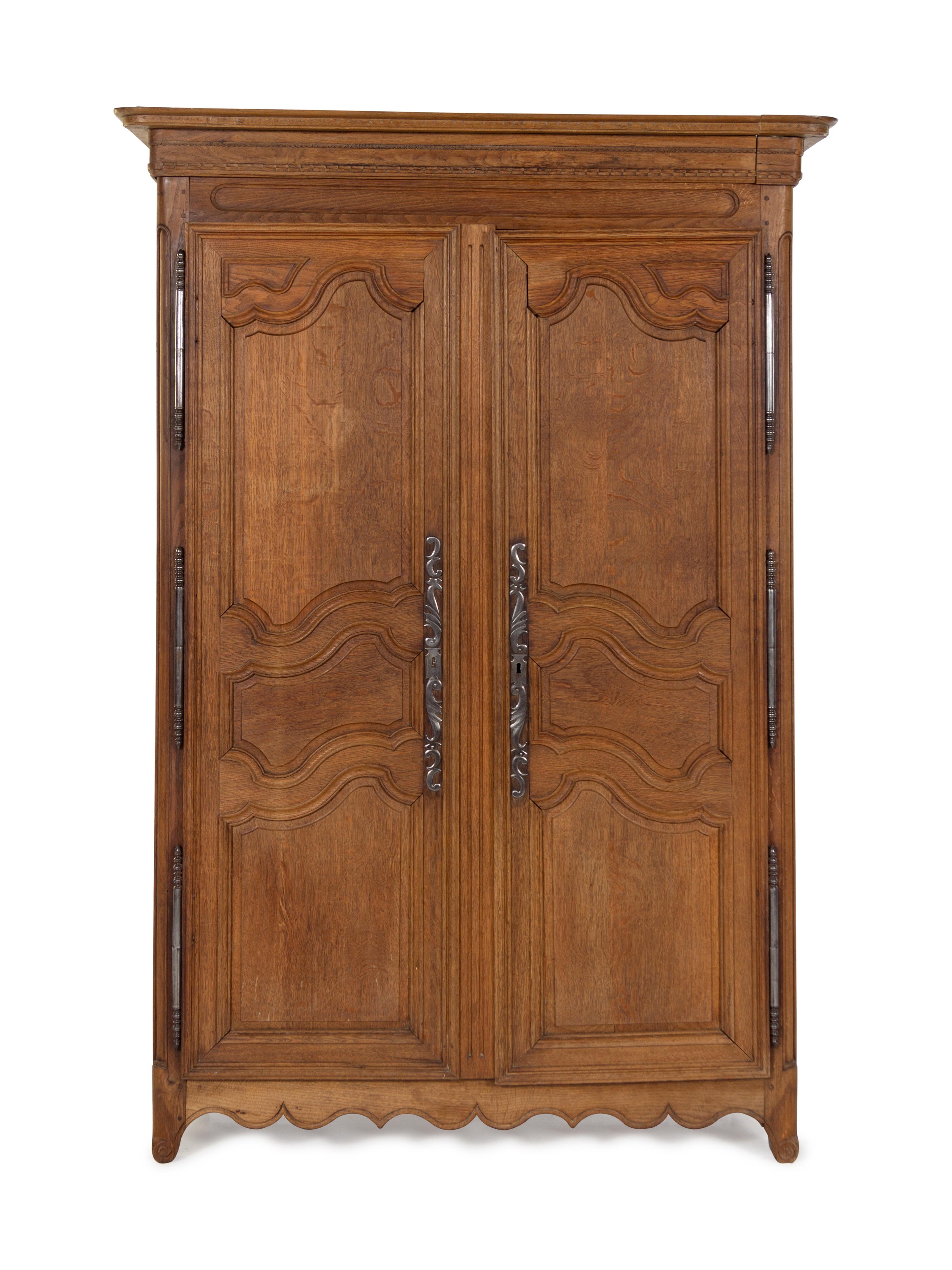 A French Provincial Carved Oak Armoire