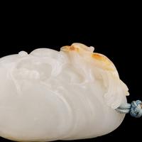 A Chinese Russet and White Jade 'Bird on Prunus' Pendant, Possibly 18th Century 或清中期 梅雀爭春巧雕玉珮