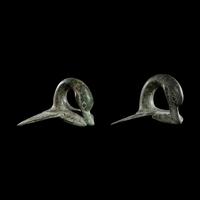 A Pair of Etruscan Bronze Vessel Handles