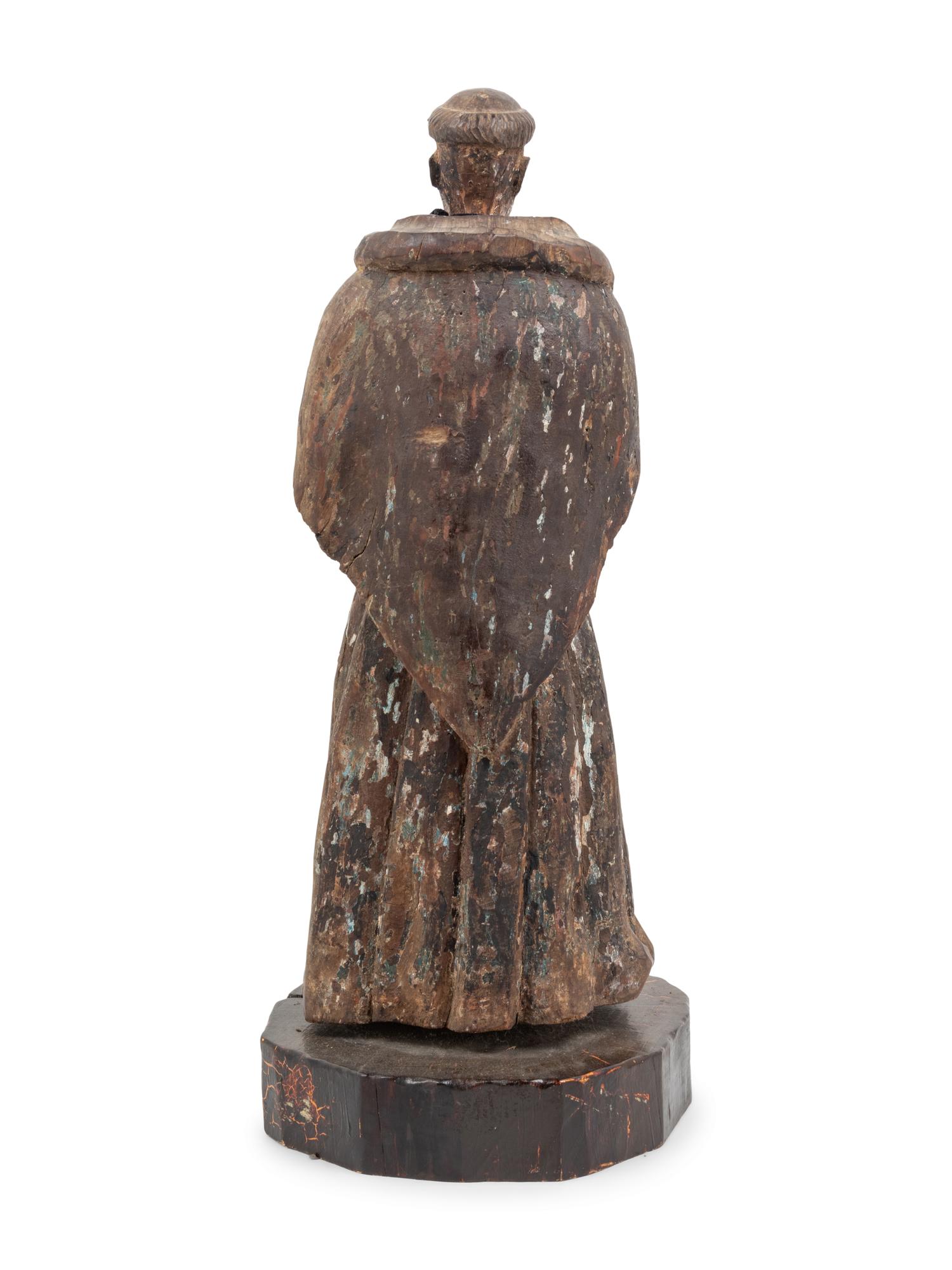 A Continental Carved and Painted Ecclesiastical Figure