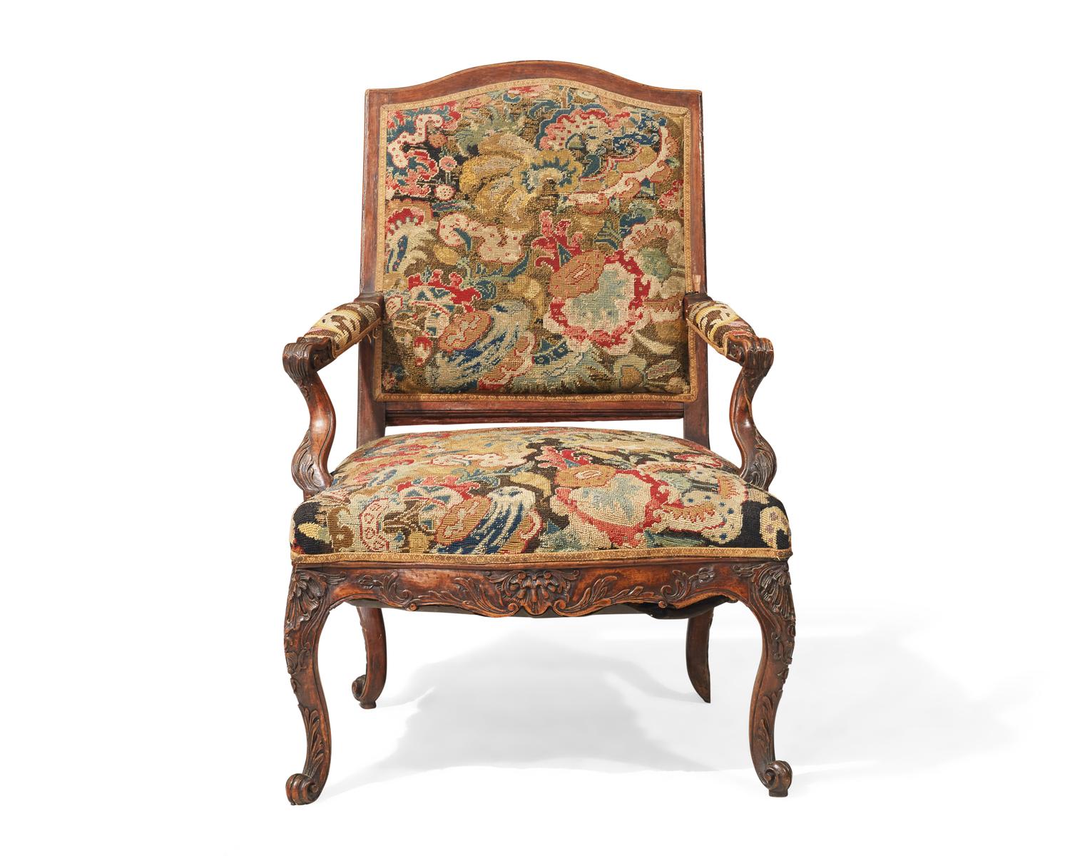 A French Régence fauteuil à la reine with petit point upholstery, 18th century
