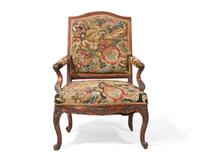A French Régence fauteuil à la reine with petit point upholstery, 18th century