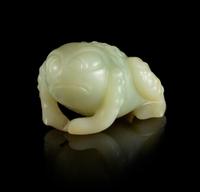 A Carved Celadon Figure of a Toad Length 2 inches.