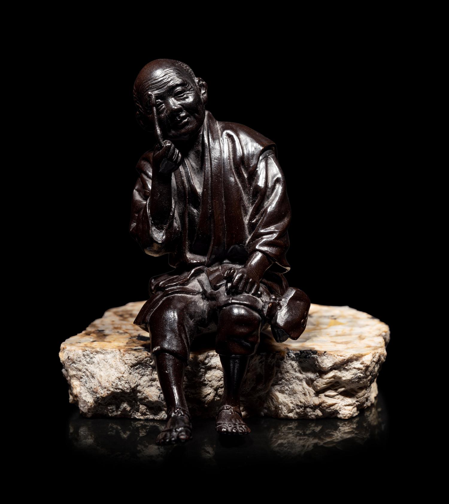A Bronze Okimono of an Elderly Man