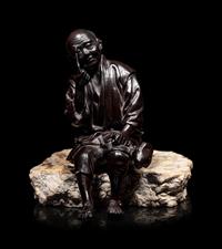 A Bronze Okimono of an Elderly Man