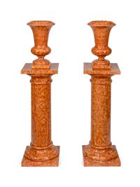 A Pair of Red Marble Urns on Pedestals — 20TH CENTURY