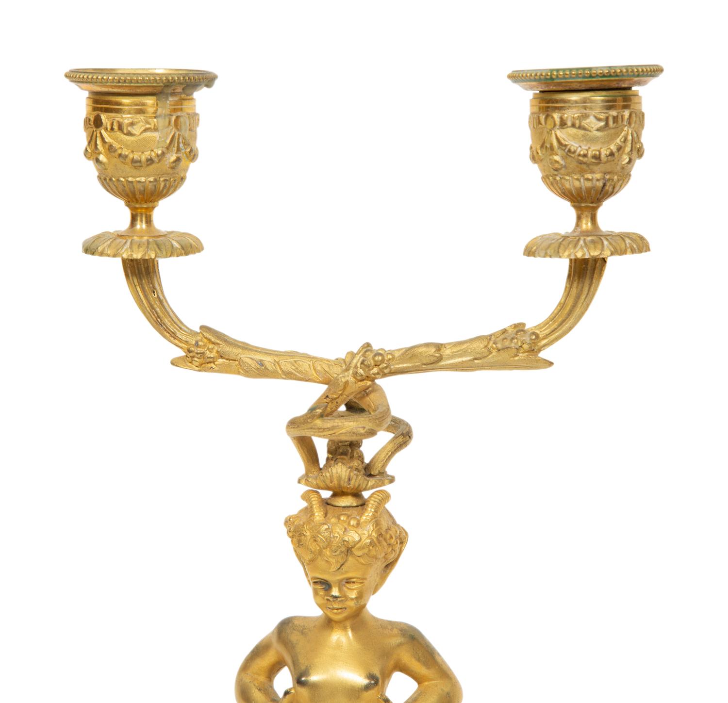 A Pair of French Gilt Bronze and Marble Figural Two-Light Candelabra