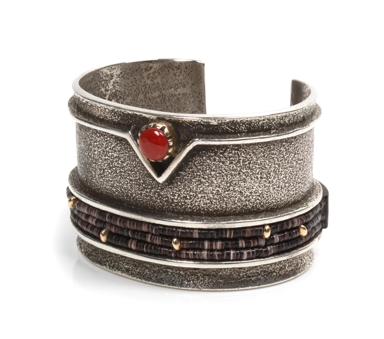 A Navajo Tufa Cast Silver, Heishi, Coral, Wood and 14K Yellow Gold Cuff, Edison Cummings, (b. 1962) Length 6 x opening 1 1/8 x width 1
