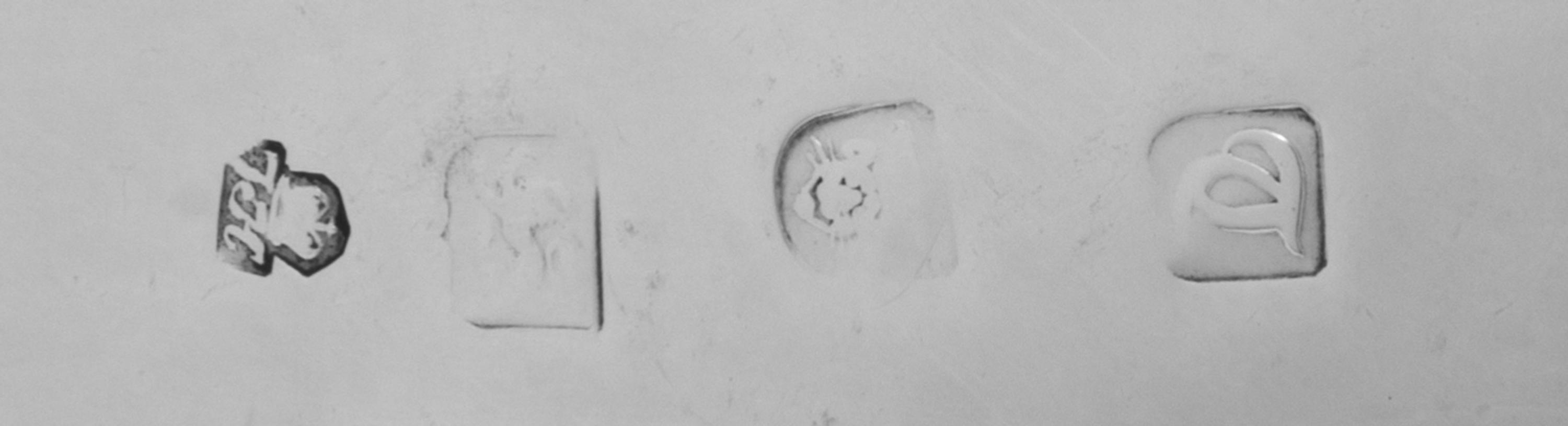 A Pair of George III Silver Sauce Boats, Thomas Heming, London, 1774, each having a gadrooned rim and a leaf-capped handle, raised on t