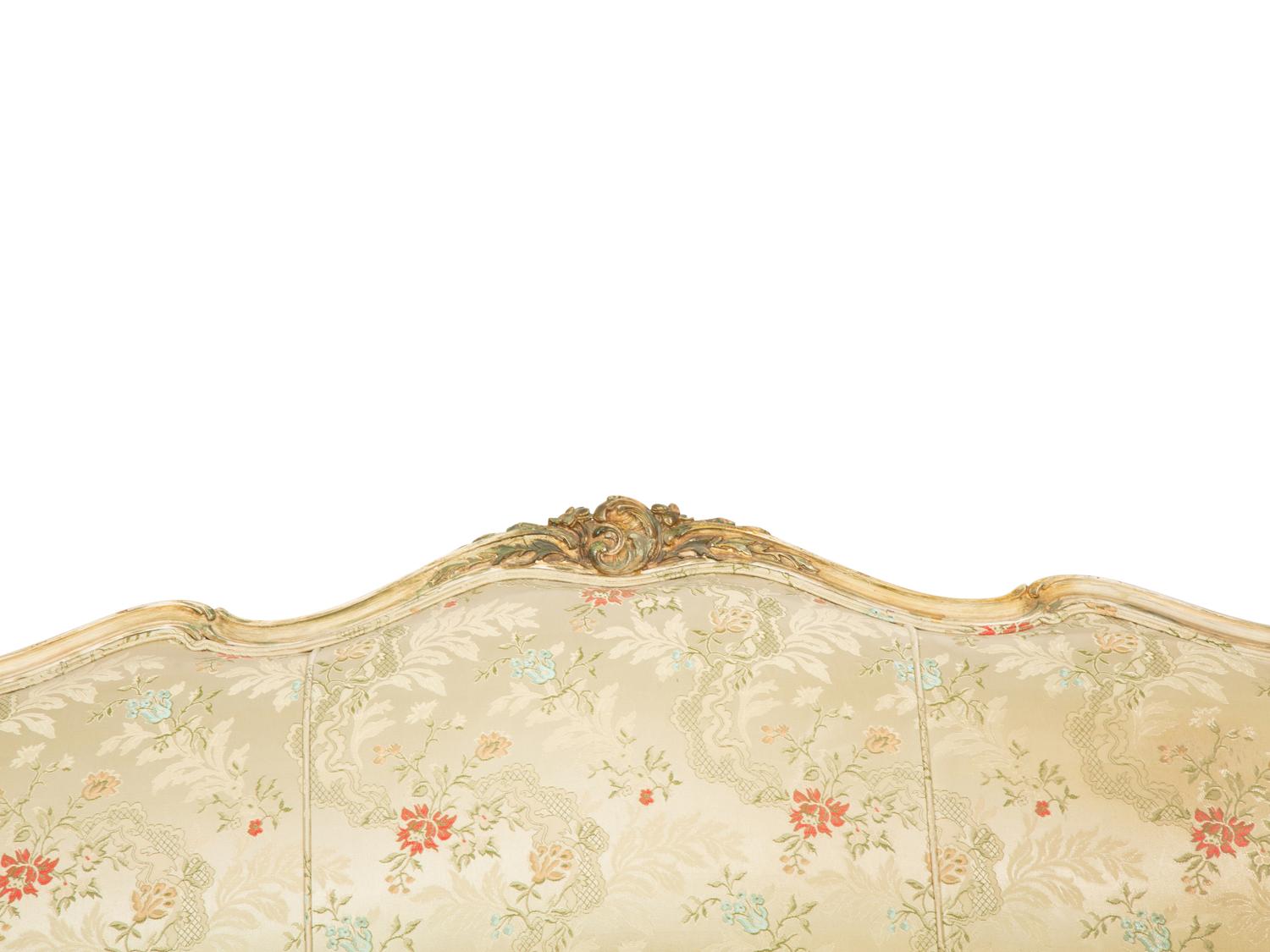 A Louis XV Style Painted and Parcel Gilt Sofa