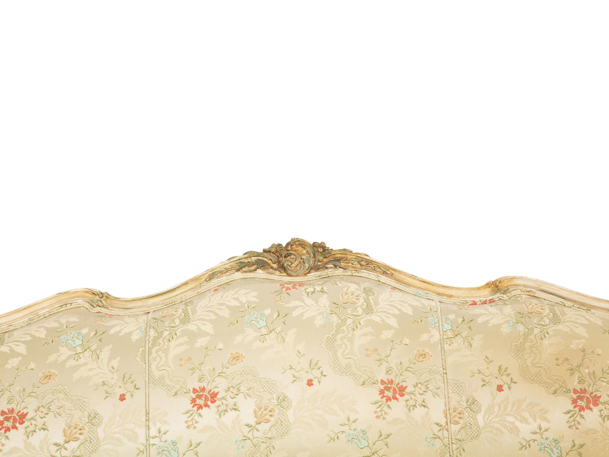 A Louis XV Style Painted and Parcel Gilt Sofa