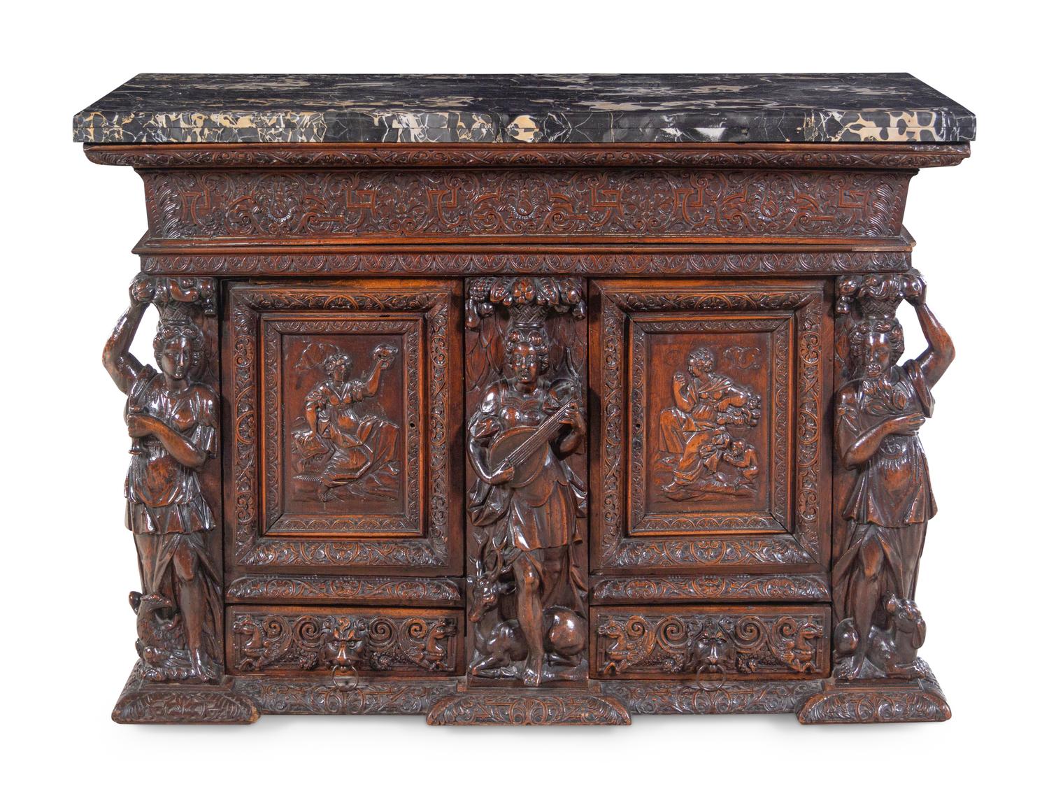 A Renaissance Revival Carved Walnut Marble-Top Cabinet