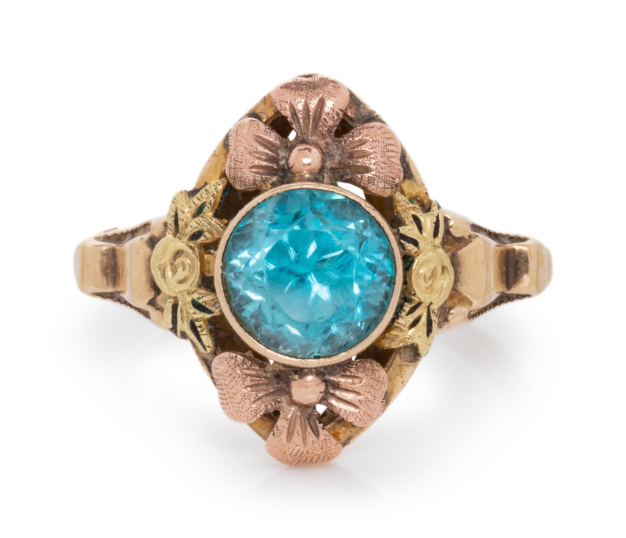 A 10 Karat Bicolor Gold and Blue Zircon Floral Motif Ring,