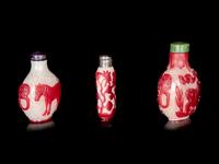 Three Chinese Red Overlay Snow Flake Ground Peking Glass Snuff Bottles