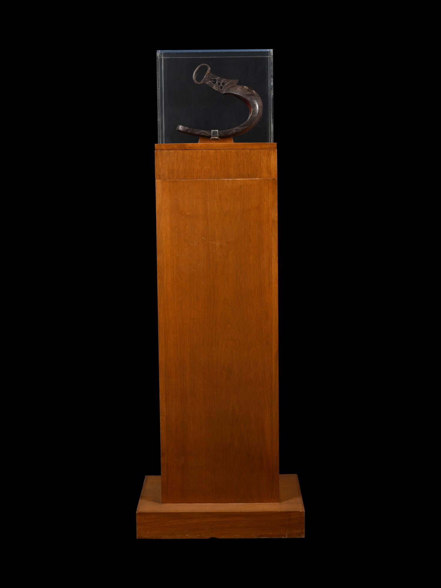 A Japanese Bronze Stirrup in a Walnut and Acrylic Pedestal Vitrine