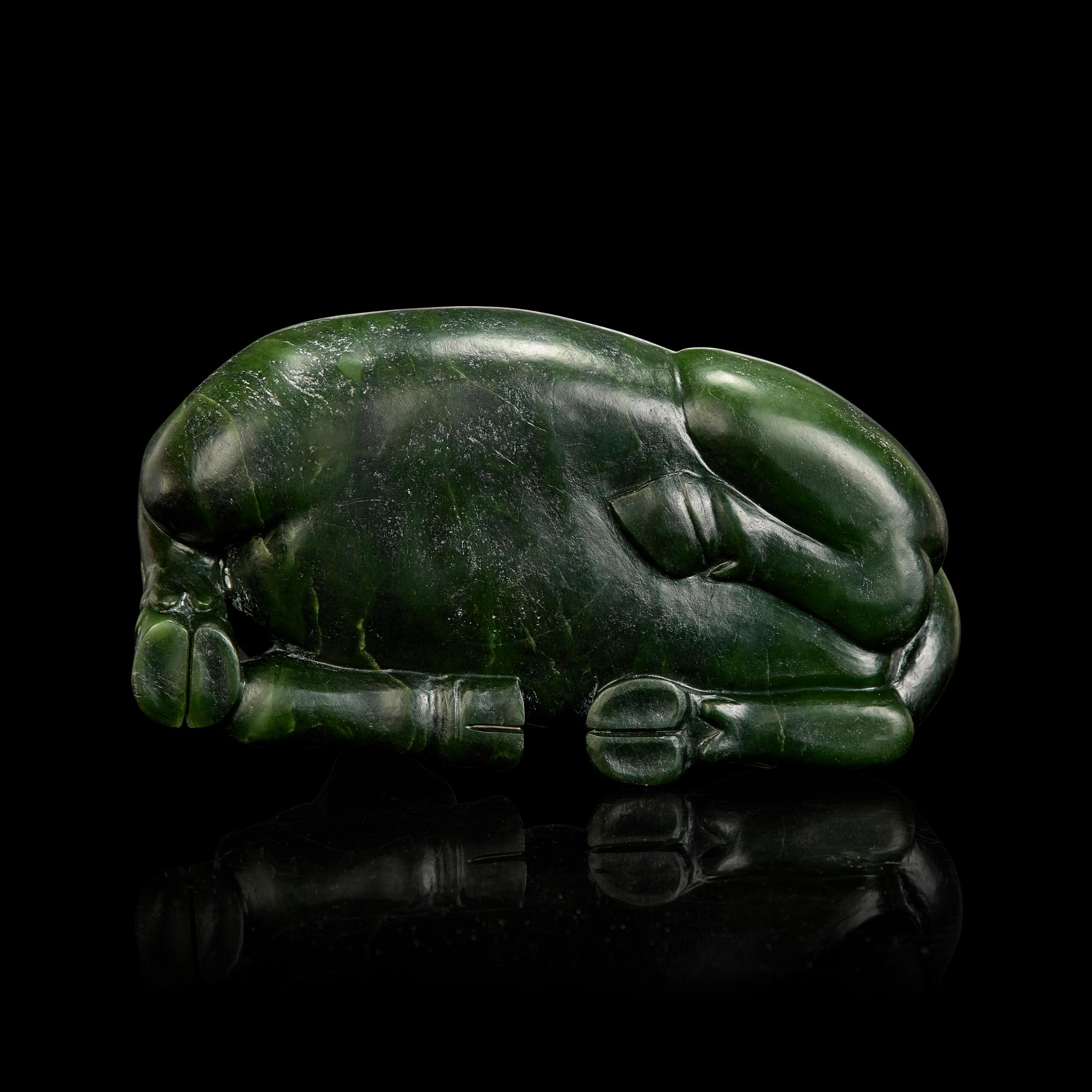 A Chinese Spinach Jade Buffalo, Qing Dynasty 清 青玉臥牛