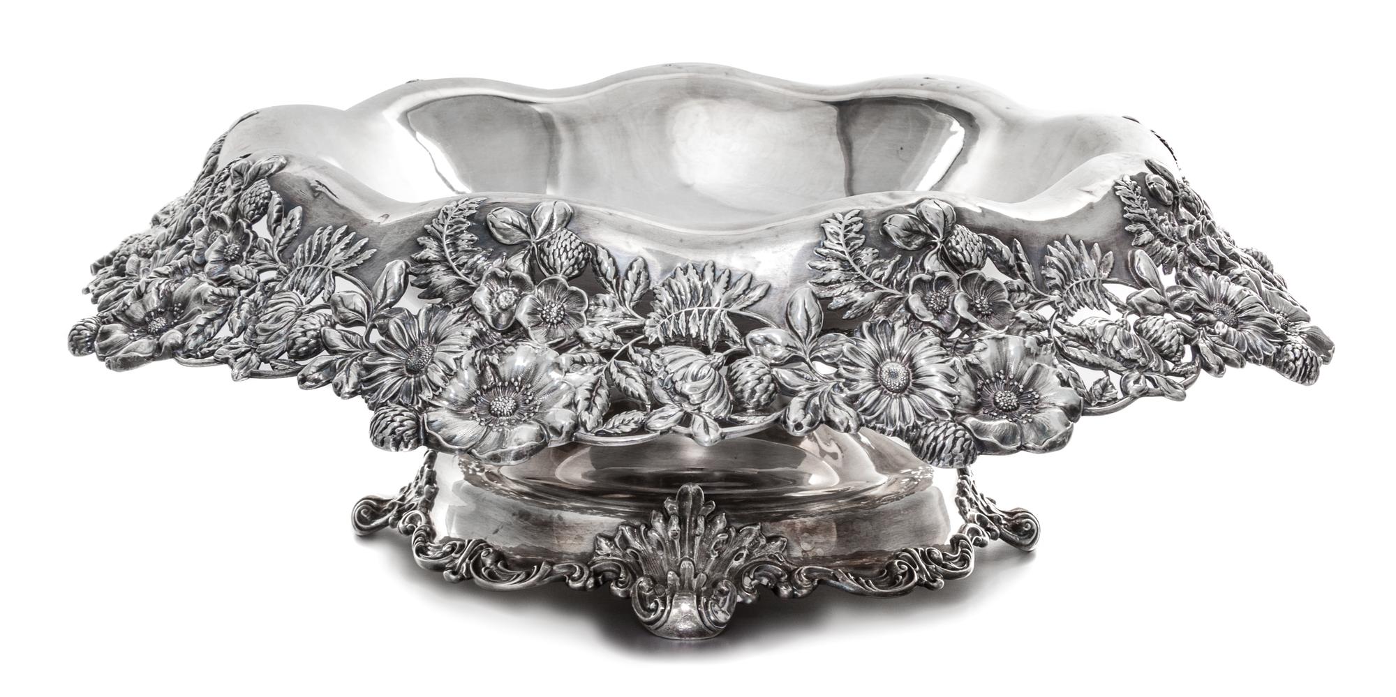An American Silver Centerpiece Bowl, Graff, Washbourn & Dunn, New York, NY, the rim worked with floral and foliate elements on a pierce