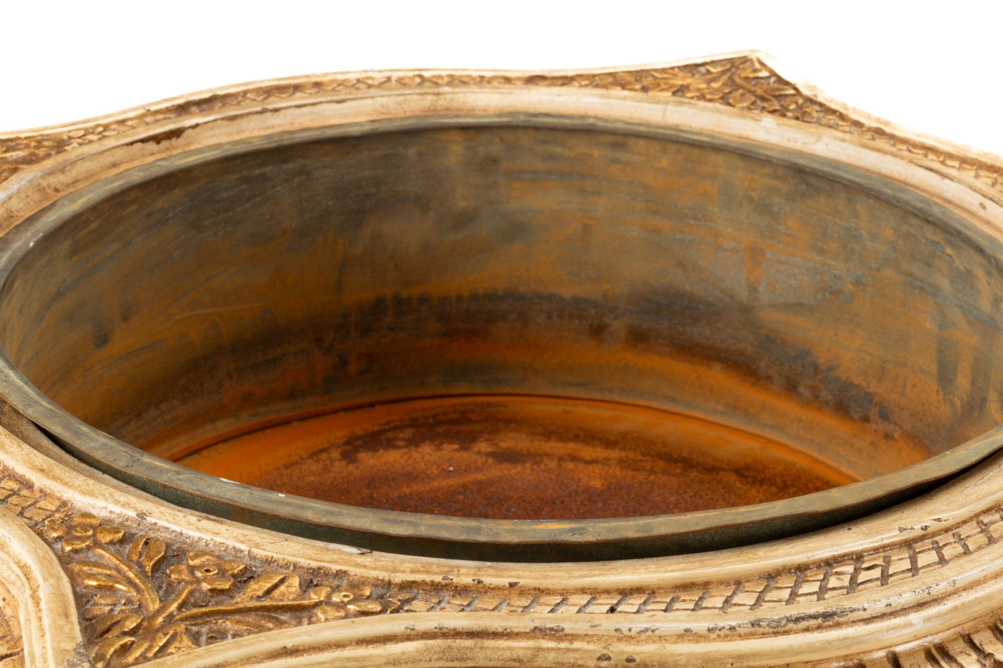 A Pair of Italian Painted and Parcel Gilt Jardinière Stands