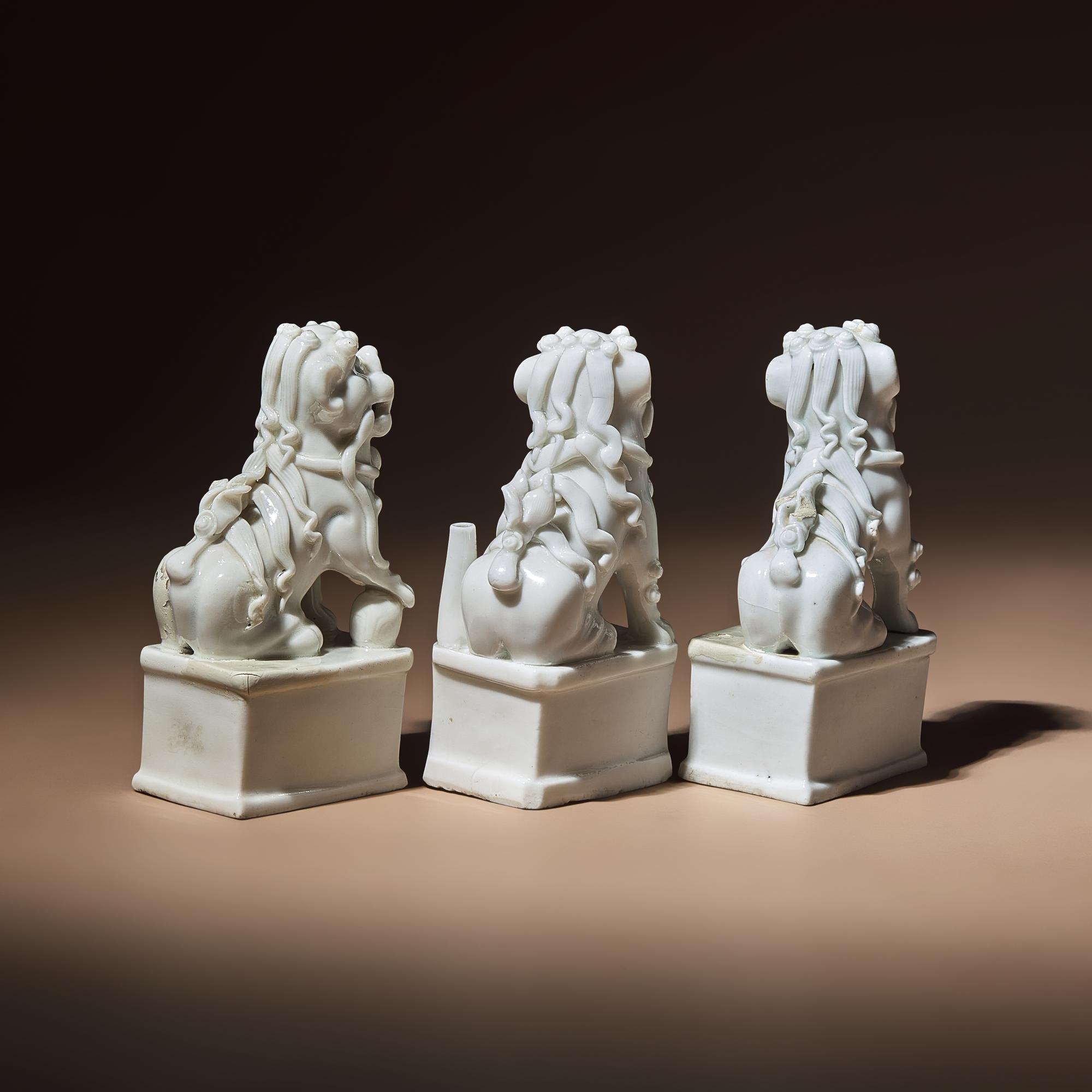Three Chinese Blanc-de-Chine Porcelain Fu Lions, 17th-18th Century — 清早中期 德化白瓷獅形香插三件