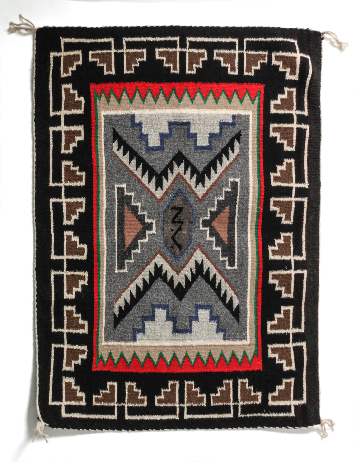 A Contemporary Teec Nos Pas Saddle Blanket 35 x 24 1/2 inches.