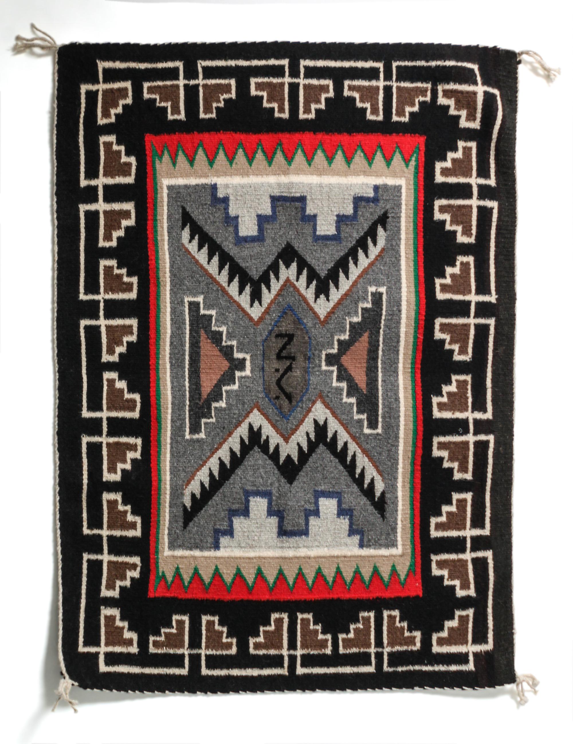 A Contemporary Teec Nos Pas Saddle Blanket 35 x 24 1/2 inches.