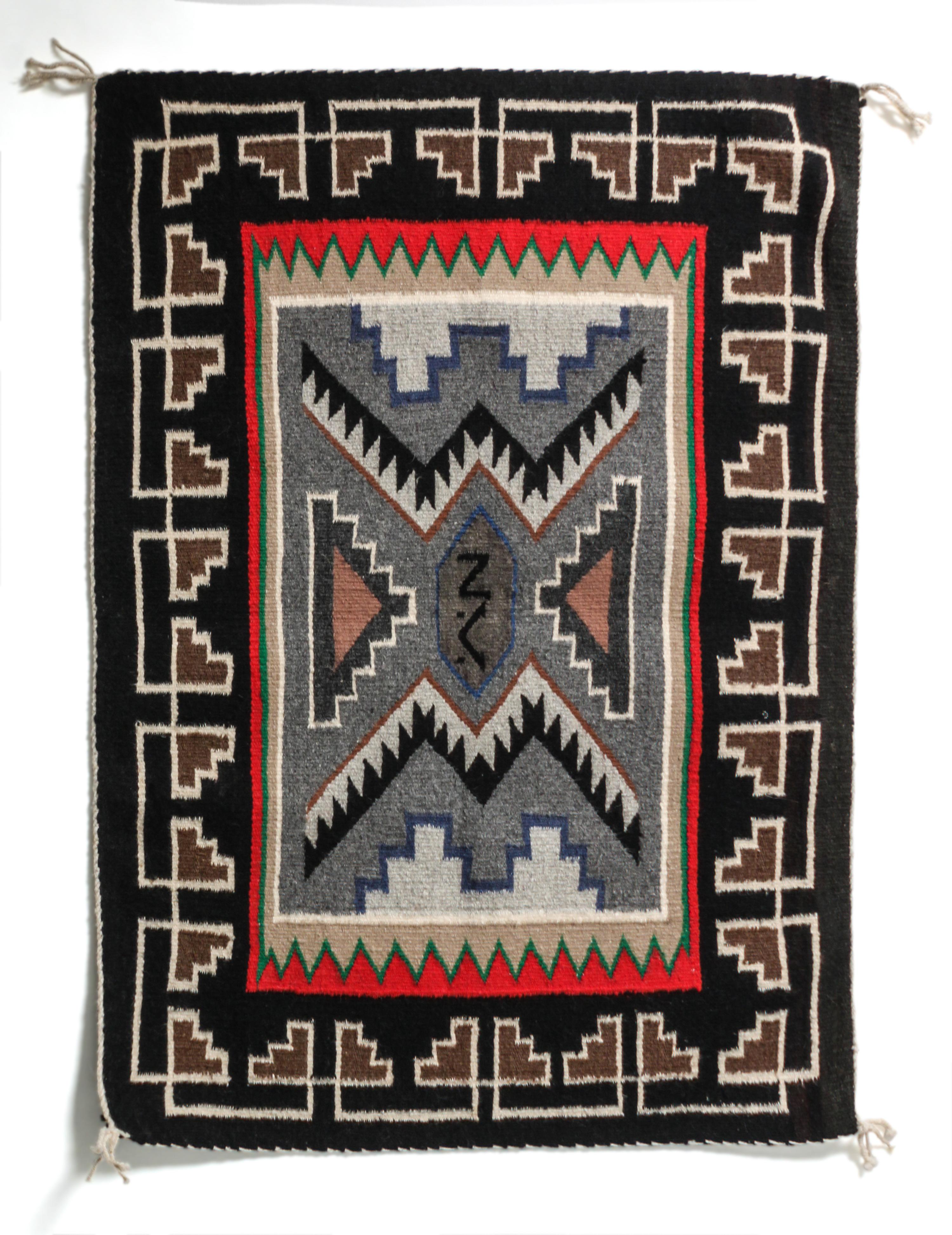 A Contemporary Teec Nos Pas Saddle Blanket 35 x 24 1/2 inches.