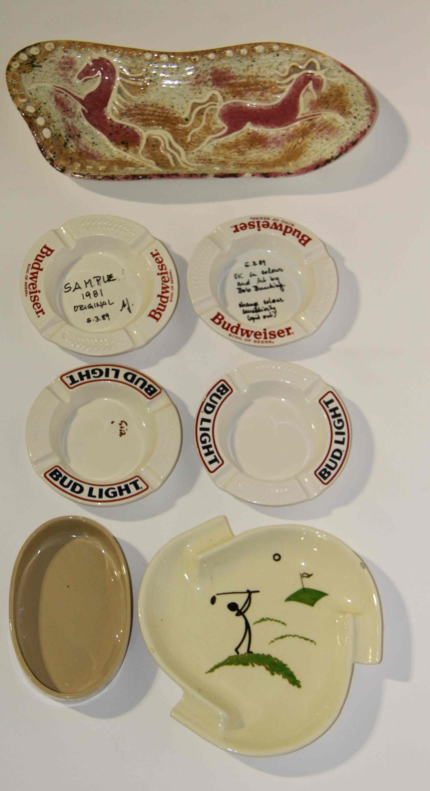 A Collection of Thirteen Haeger Pottery Ash Receivers Width of widest 13 1/4 inches.