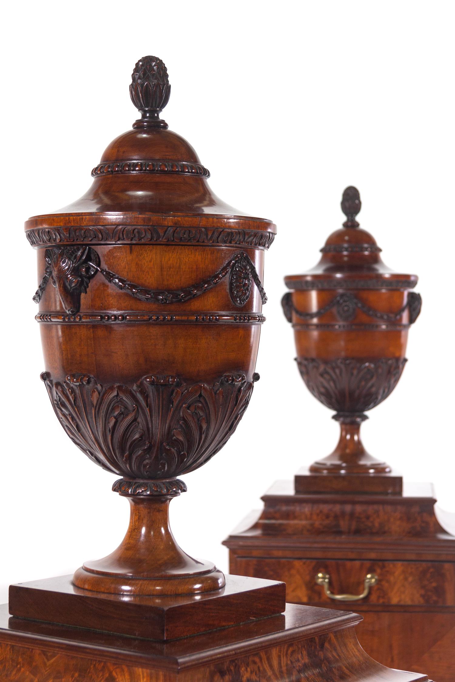 A Pair of Edwardian Style Mahogany Cutlery Urns on Pedestals