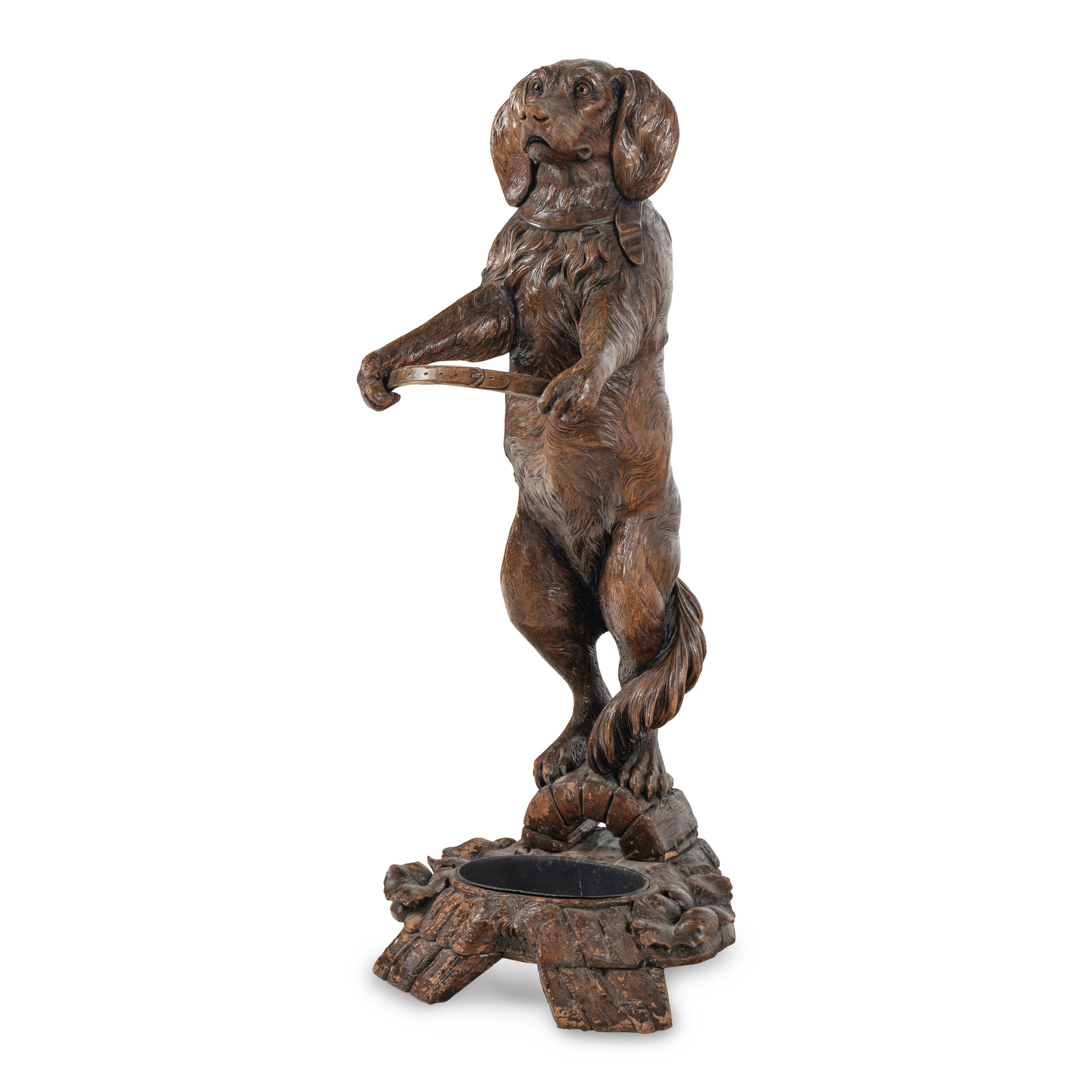 A Swiss "Black Forest" Carved Figural Umbrella Stand