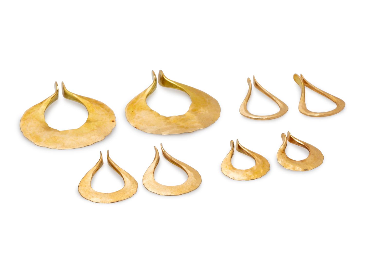 A Collection of 14 Karat Yellow Gold Hoop Earclips, Calf & Dragon,