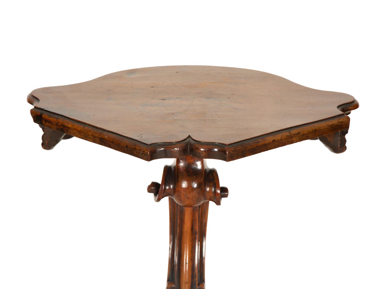 An Italian Rococo Carved Walnut Tripod Stand