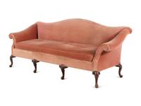A George III Style Carved Mahogany Camel Back Sofa