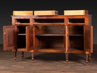 An American Empire Carved and Highly Figured Mahogany and Cherrywood Sideboard
