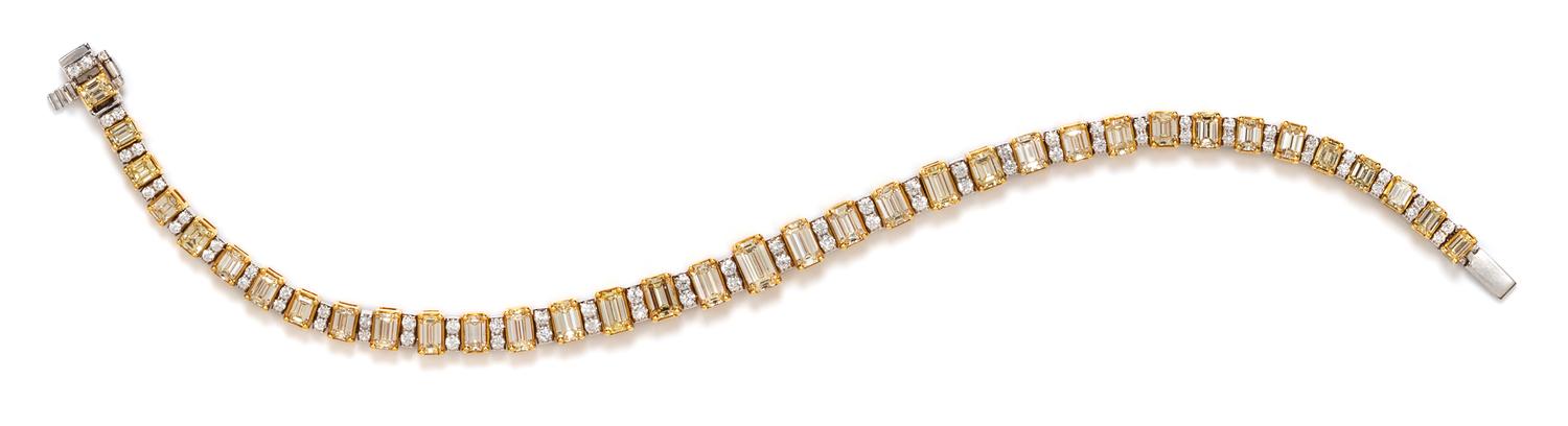 An 18 Karat Bicolor Gold, Colored Diamond and Diamond Line Bracelet, 15.55 dwts.