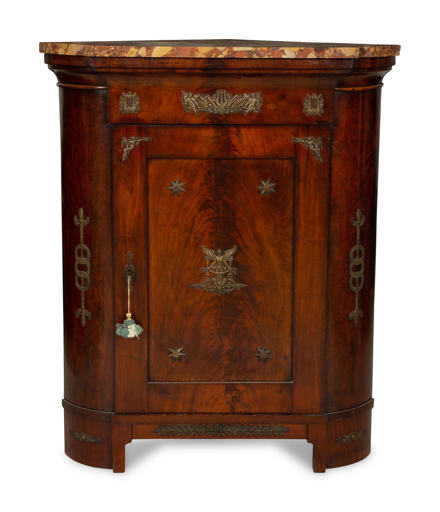 An Empire Gilt Bronze Mounted Mahogany Encoignure with a Brèche d'Alep Marble Top
