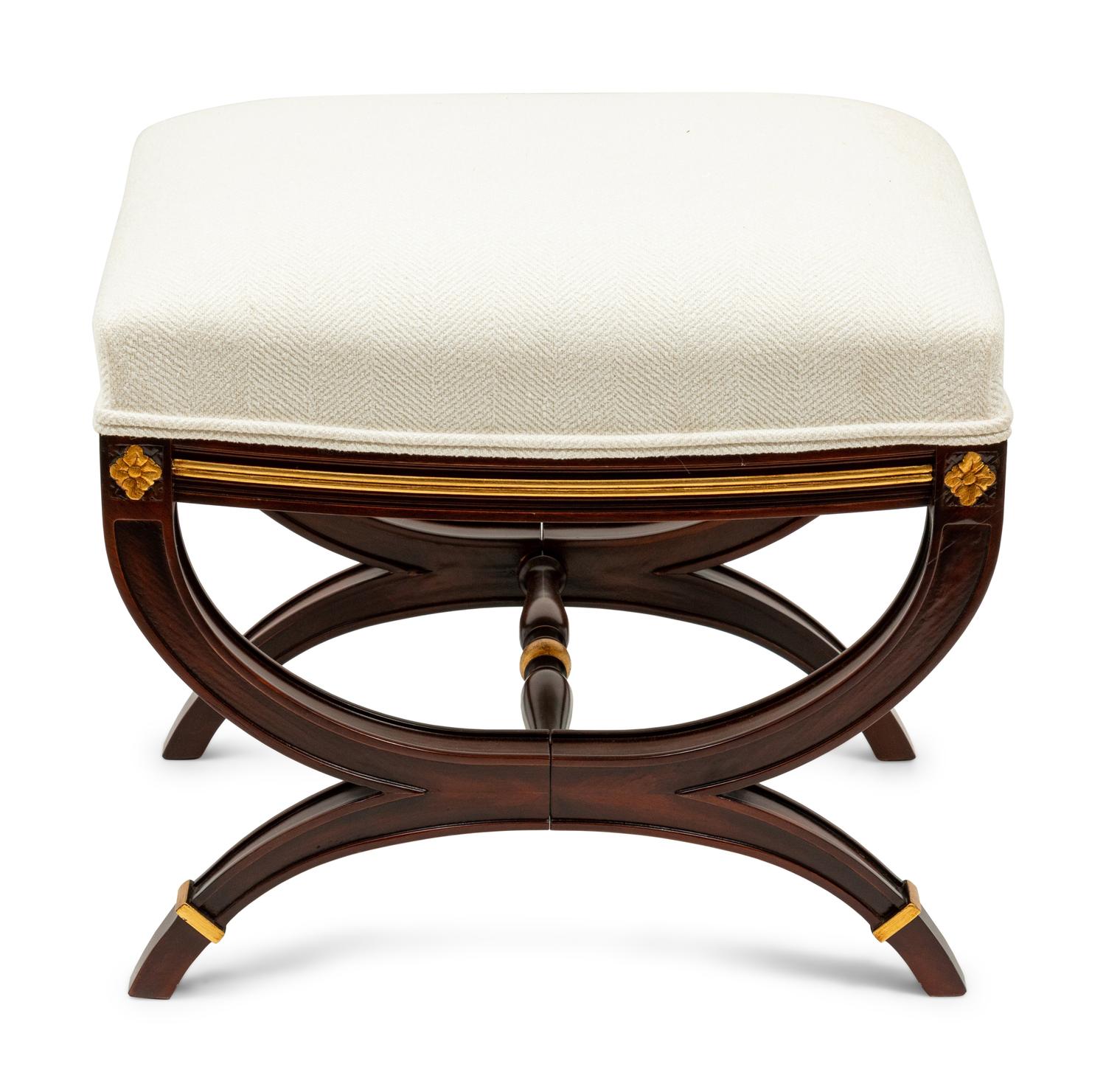 A Directoire Style Parcel Gilt Ottoman