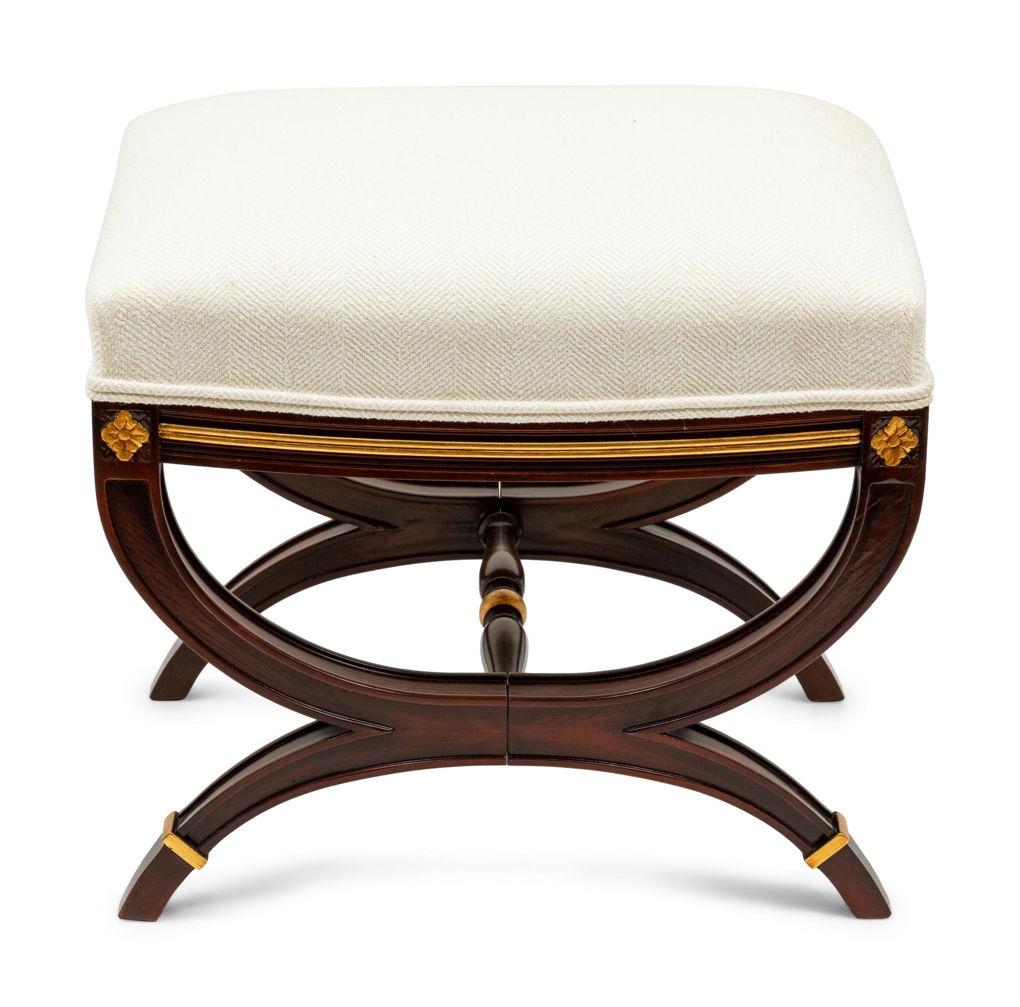 A Directoire Style Parcel Gilt Ottoman