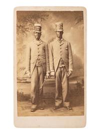 [AFRICAN AMERICANA - EARLY PHOTOGRAPHY]. Occupational CDV featuring two African American men advertising Higgins Berman Laundry Soap. Brooklyn, NY: B. Block.