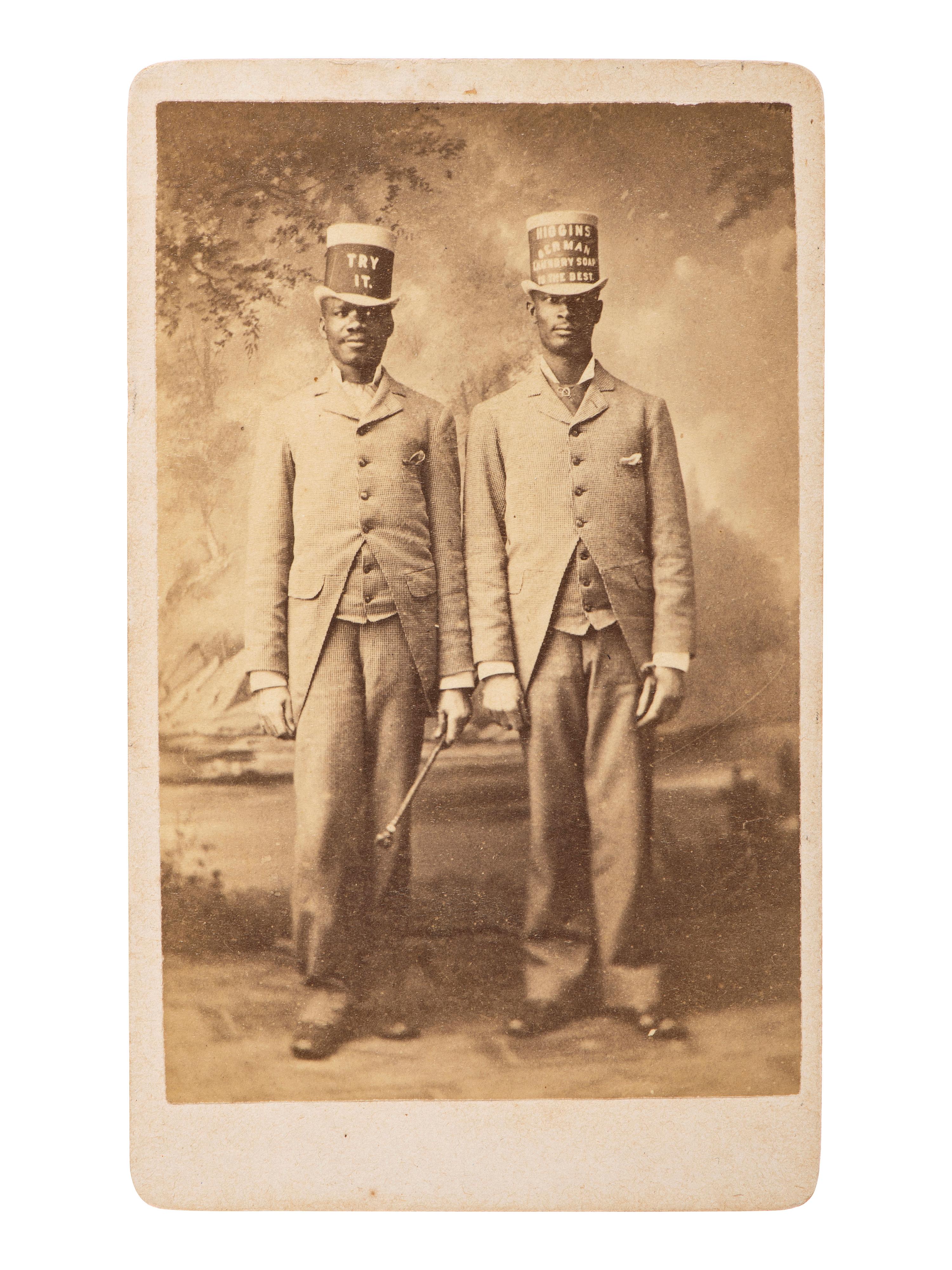 [AFRICAN AMERICANA - EARLY PHOTOGRAPHY]. Occupational CDV featuring two African American men advertising Higgins Berman Laundry Soap. Brooklyn, NY: B. Block.