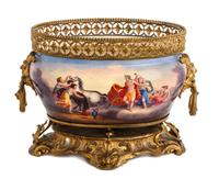 A Continental Gilt Metal Mounted Ceramic Jardiniere Width 13 inches. — LATE 19TH CENTURY
