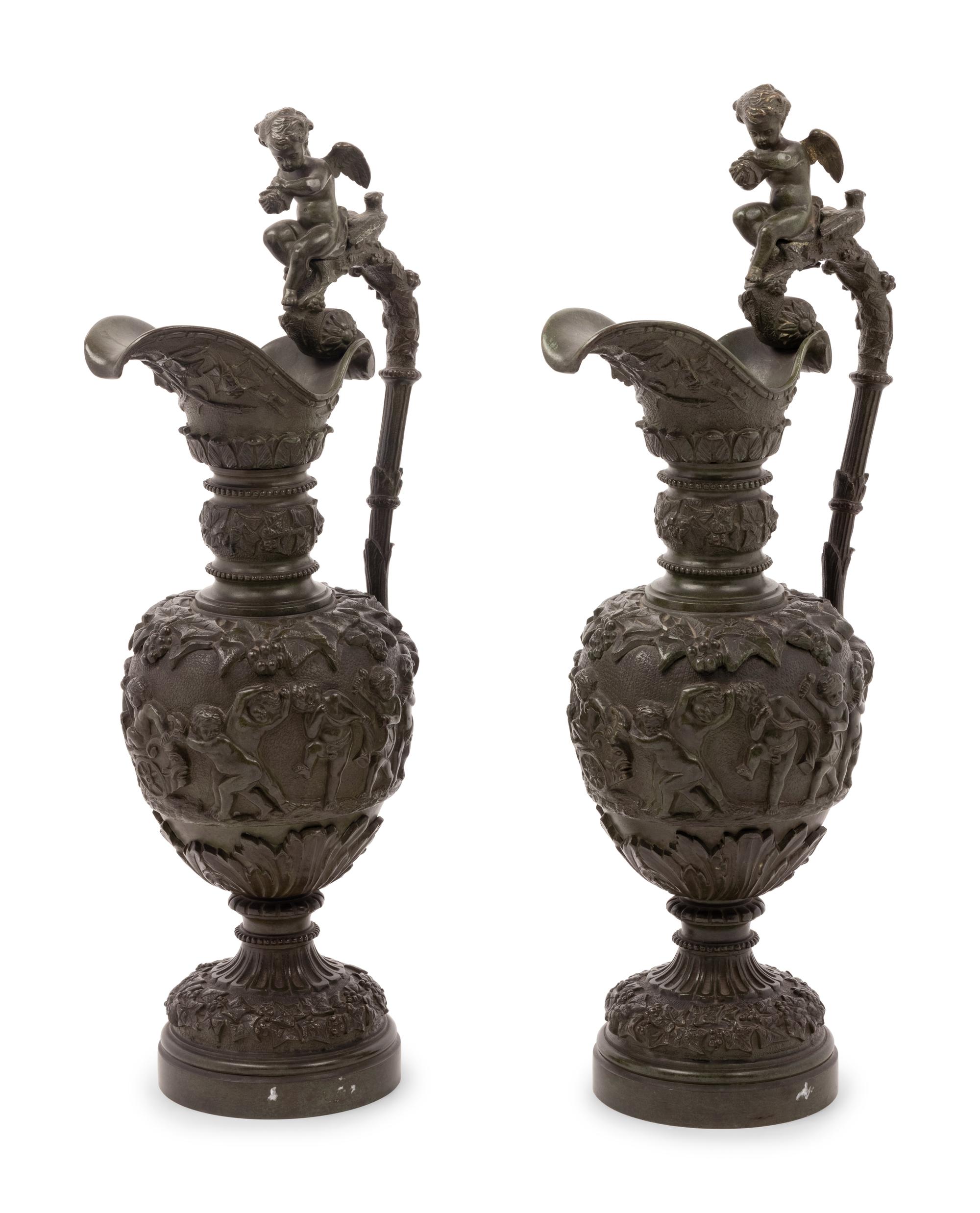 A Pair of Neoclassical Patinated Bronze Ewers with Bacchic Putti