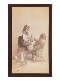 [NATIVE AMERICANS] DE GROFF, Edward, photog. 2 boudoir cards of a Haida shaman. Sitka, AK, ca 1890.