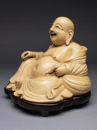 A White Glazed Figure of Budai Buddha