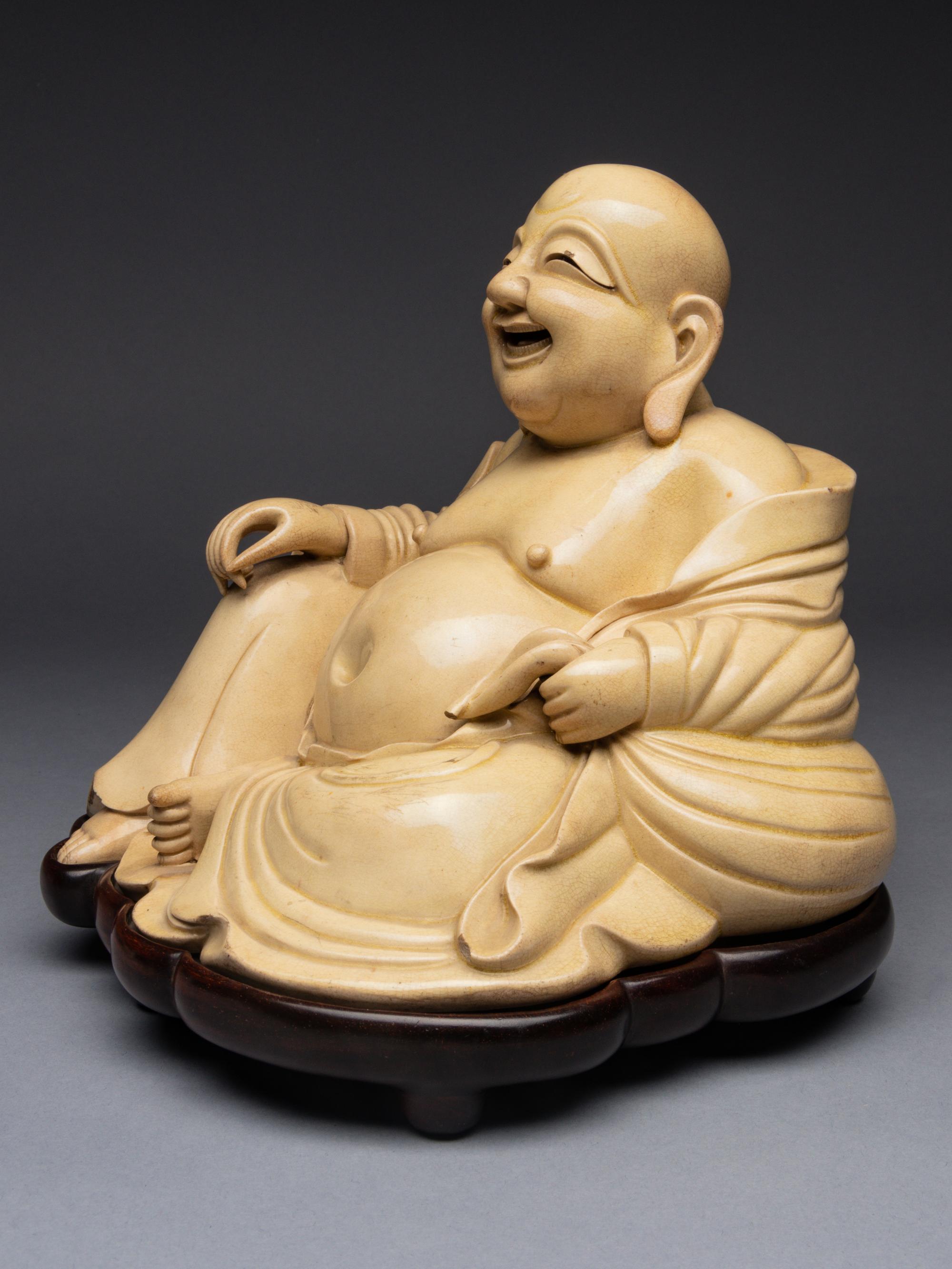 A White Glazed Figure of Budai Buddha
