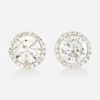 A pair of diamond and gold earrings