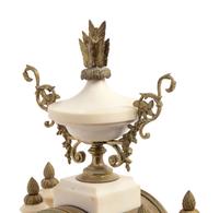 A French Gilt Metal Mounted Marble Three-Piece Clock Garniture