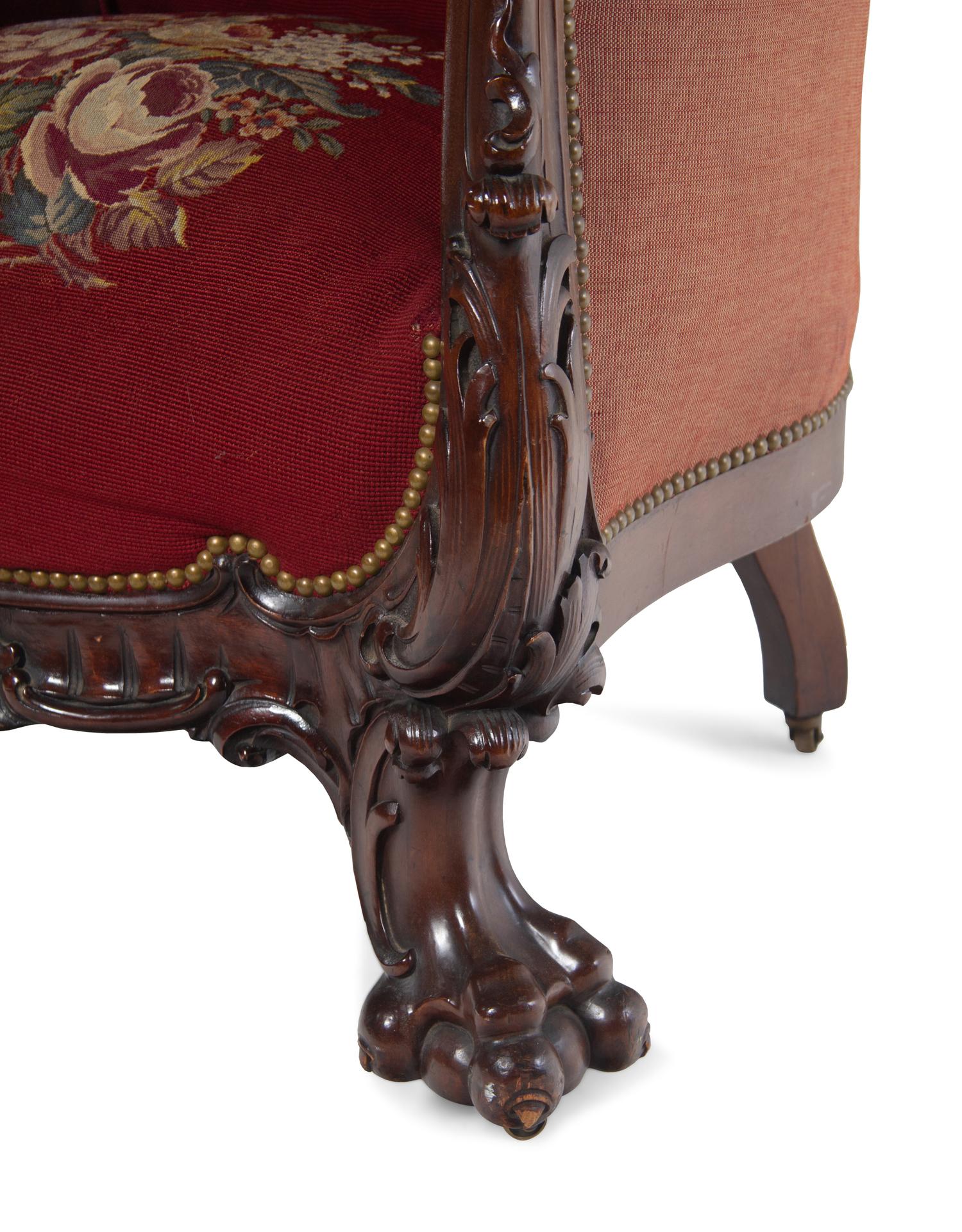 A Rococo Revival Carved Walnut Three-Piece Seating Suite in the Style of Karpen